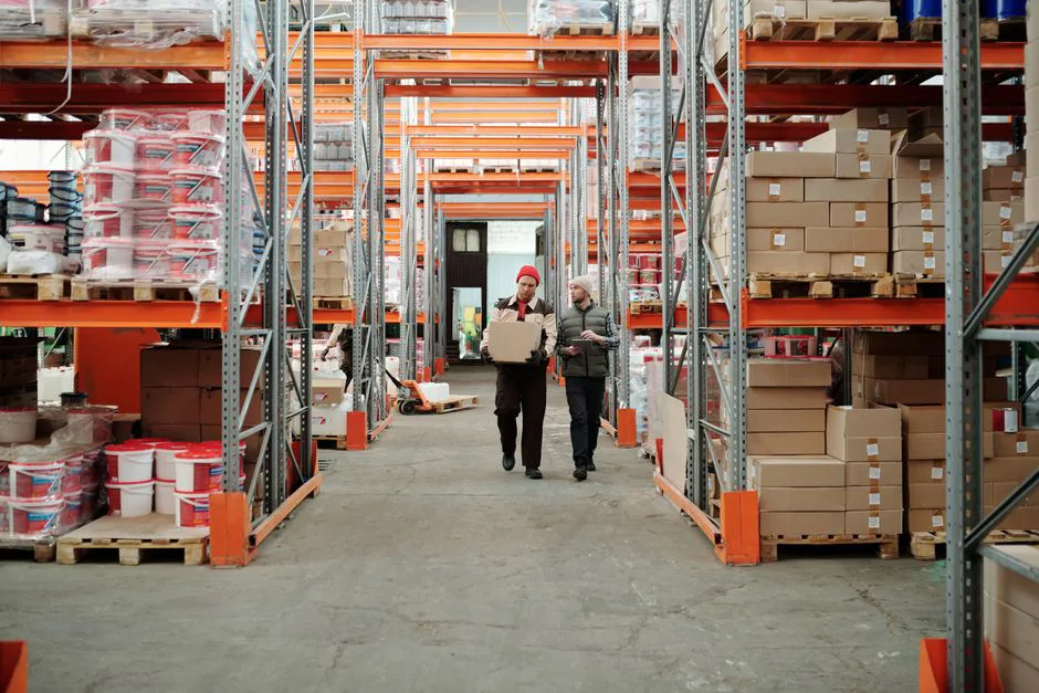 Interior of Obserway's US warehouse in Hidalgo, Texas with workers processing packages and loading trucks for Mexico