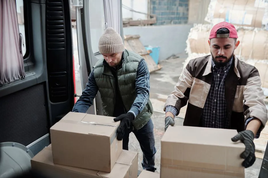 Warehouse worker packing boxes for cross-border shipment to Mexico