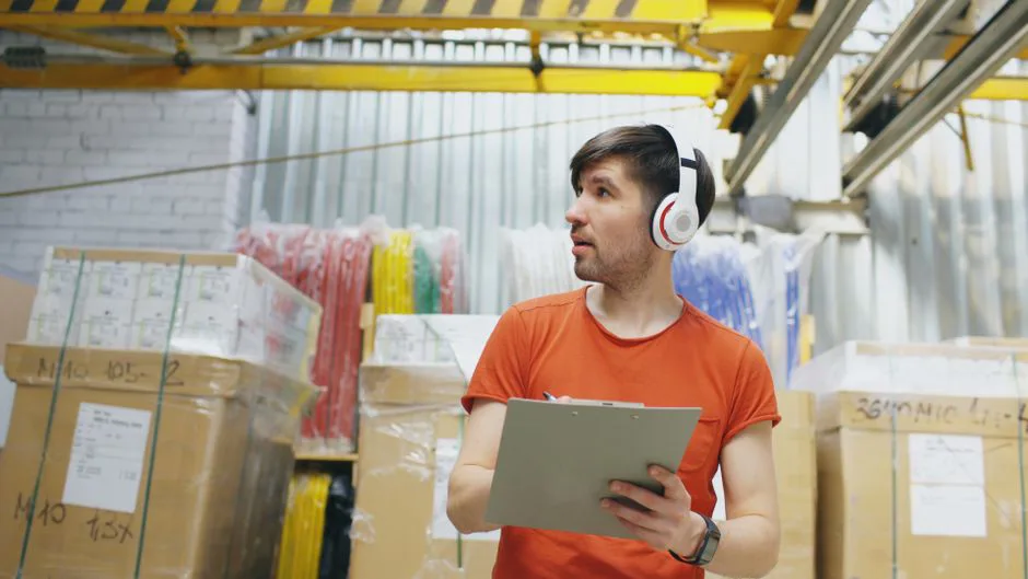 Warehouse worker inspecting returned packages in Mexico