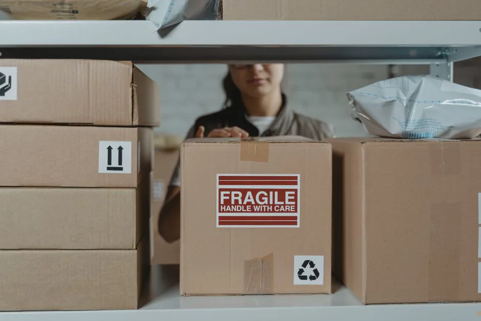 Warehouse worker packing boxes for Mexico shipment